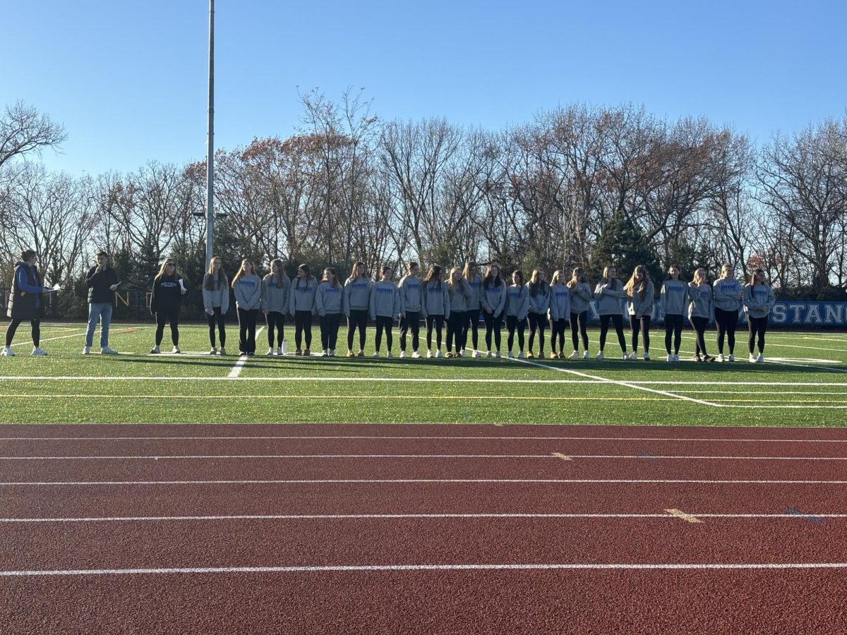 The field hockey team being honored at the pep-rally