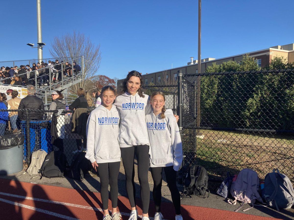 Cross country runners, Bridget Flynn, Natalie Martin, and Kerin Gorman