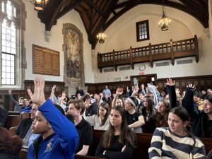 Students vote during their mock town meeting.
