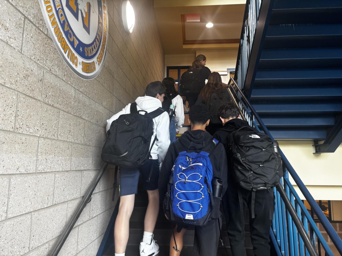 Freshmen walking up to floor two during passing period