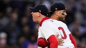 Pitcher Walker Buehler yelling at the Umpire and being held back by Catcher Carlos Narvaez. 