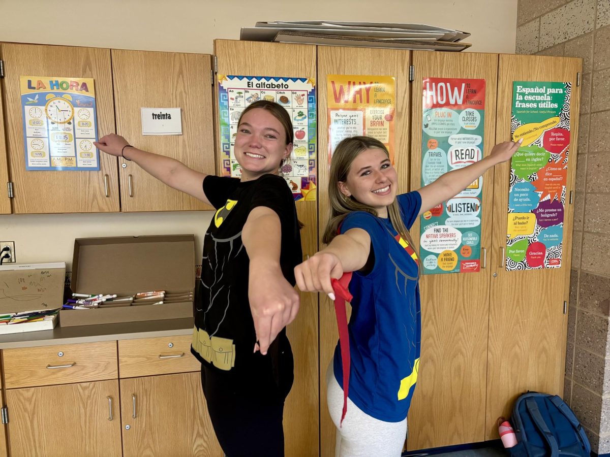Seniors Grace Connell (Left) and Grace Brousaides (Right) looking heroic as Batman and Superman on dynamic-duo day