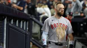 Trevor Story standing in the dugout after the Red Sox were eliminated from the Playoffs.