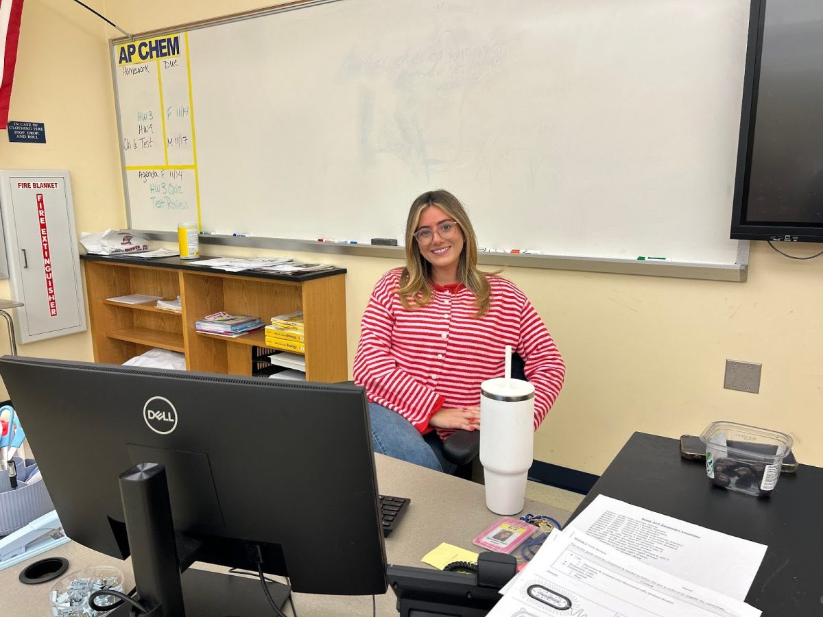 Doyle sitting at her desk doing lesson planning.