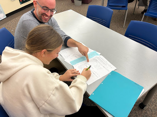 Freshman Anna MacDougall gets extra help from Geometry teacher Joey Killian.
