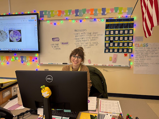 Anna Edgren sitting at her desk putting grades into aspen 
