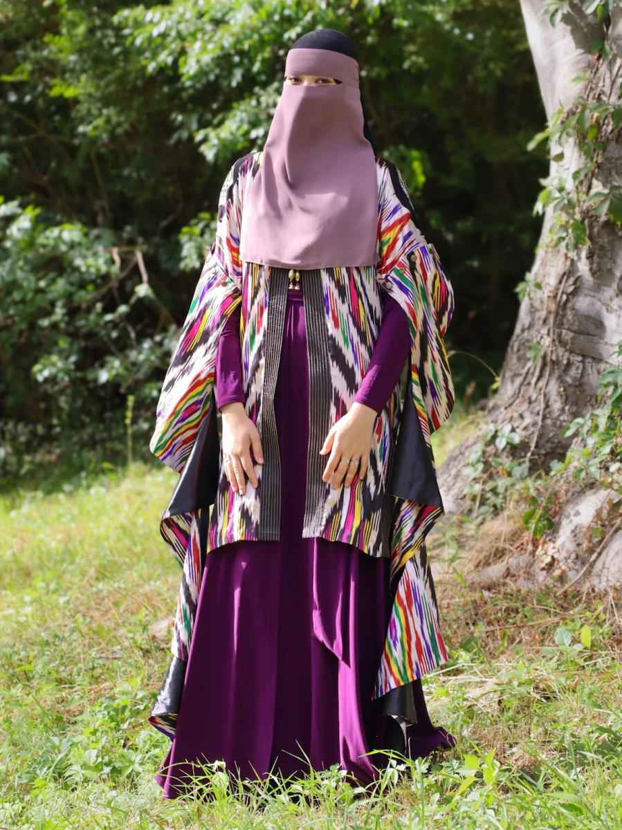 Ozodova’s gorgeous Senior photos, where she donned a traditional patterned fabric known as atlas. 