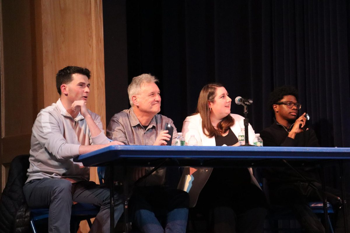Joseph O'Connor, James Lee, Elizabeth Colahan, and Deandrey Alexandre sitting on the judges panel 