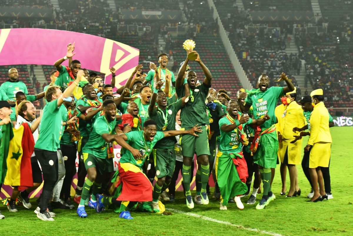 Senegal hoisting the AFCON trophy after beating Morocco in the finals 

