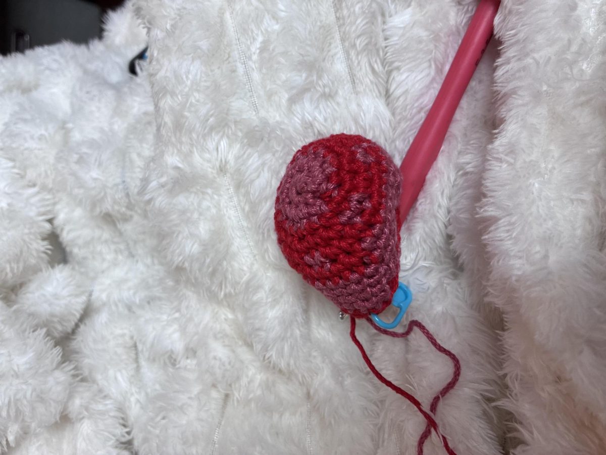 Lexie Powers crochets a hacky sack