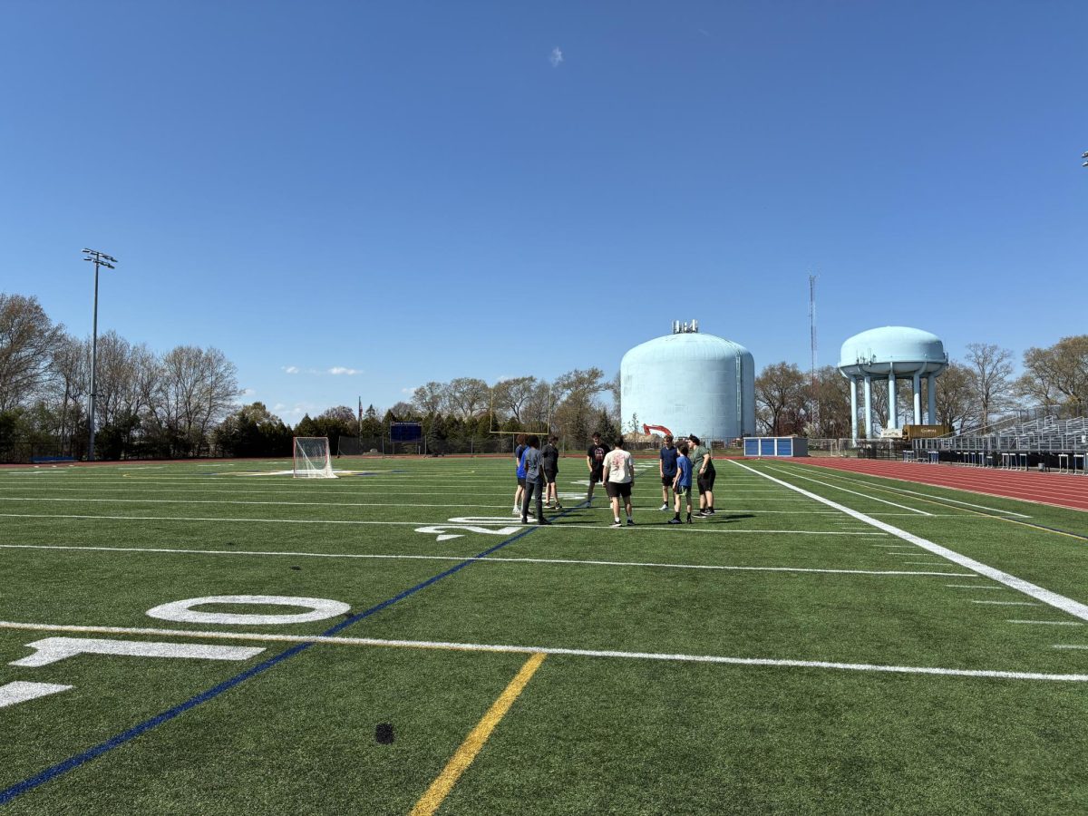 NHS track athletes kick the sack around before practice