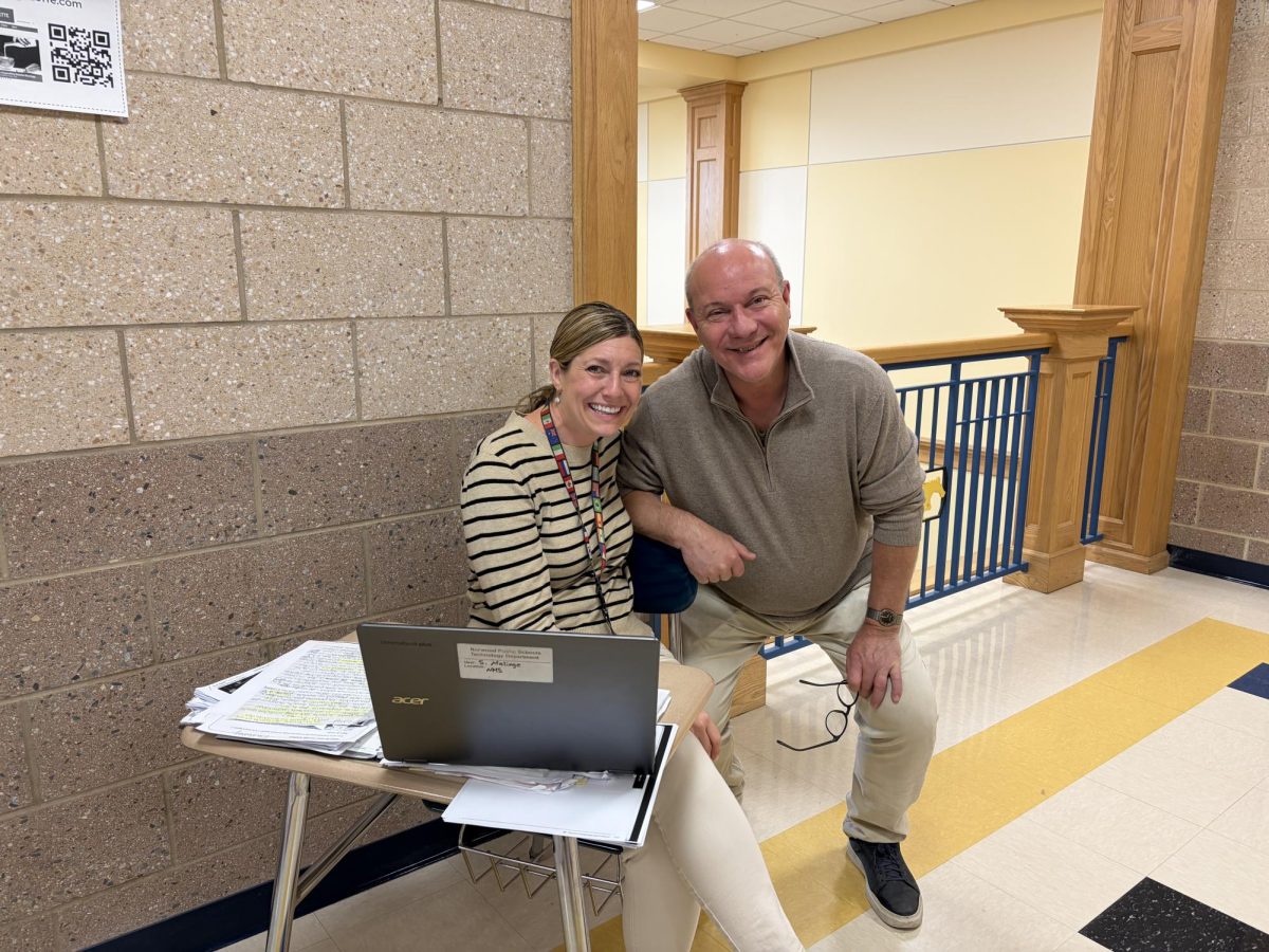 French teachers Madame Malinge and Mr. Buhler on hall duty