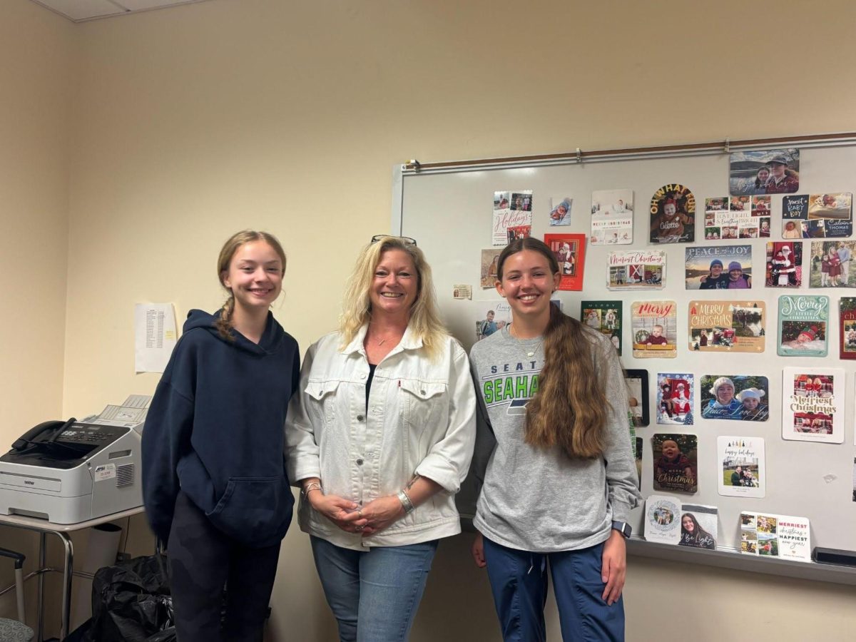 (From left to right) President Eleanor Kidd, Advisor Leah Stevens, Treasurer Emily Morgan